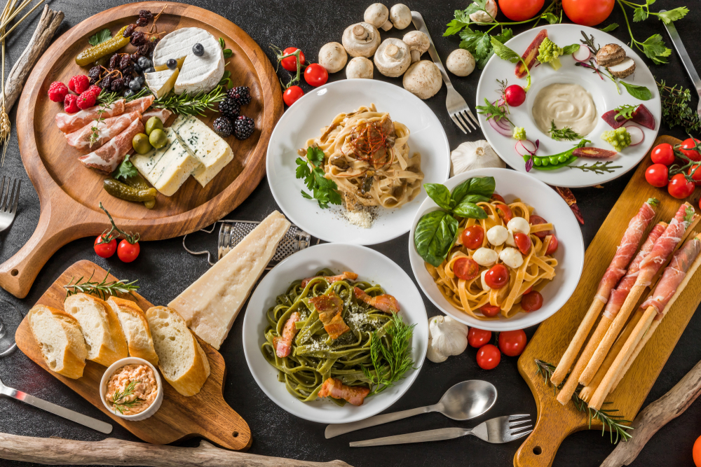 Assortment of colorful dishes served in bowls and plates