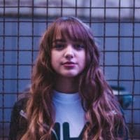 Portrait of a woman with long hair and bangs