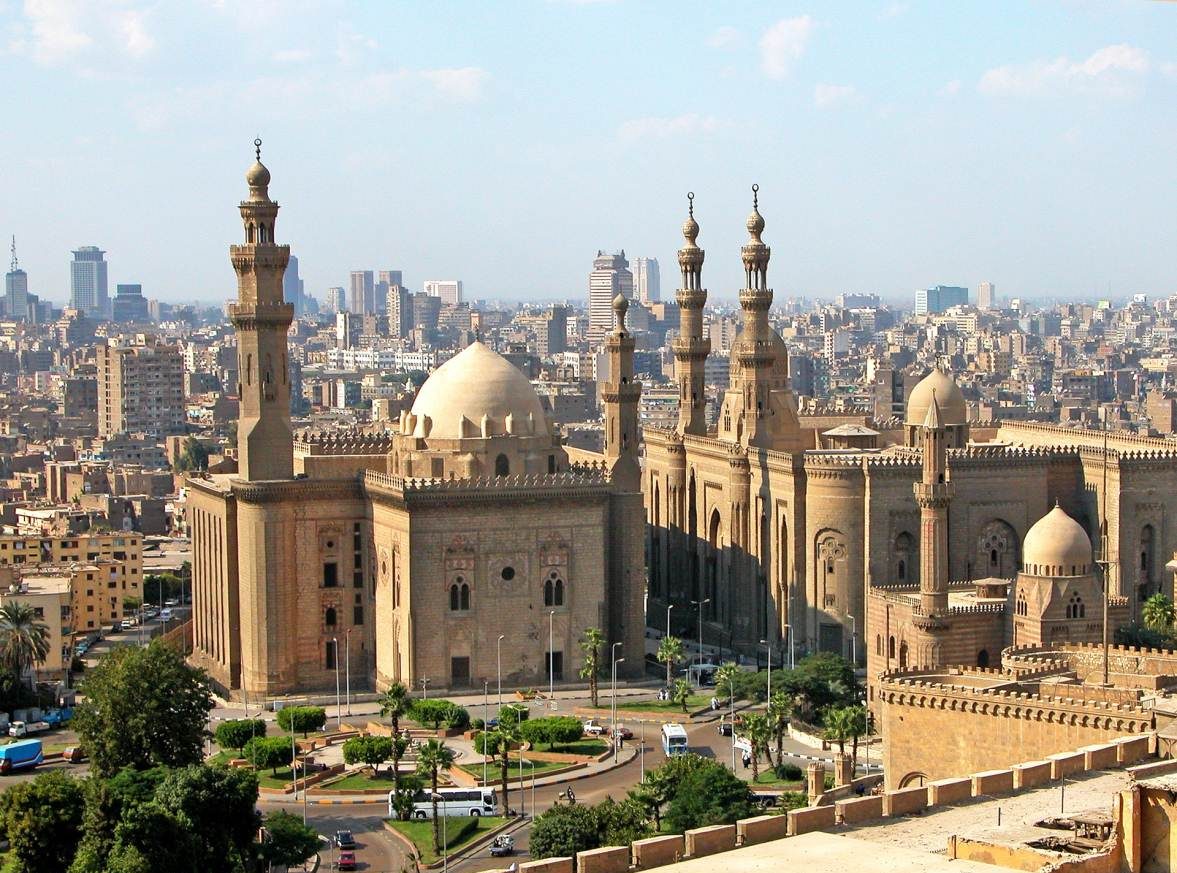 Mosque domes and minarets above Cairo rooftops